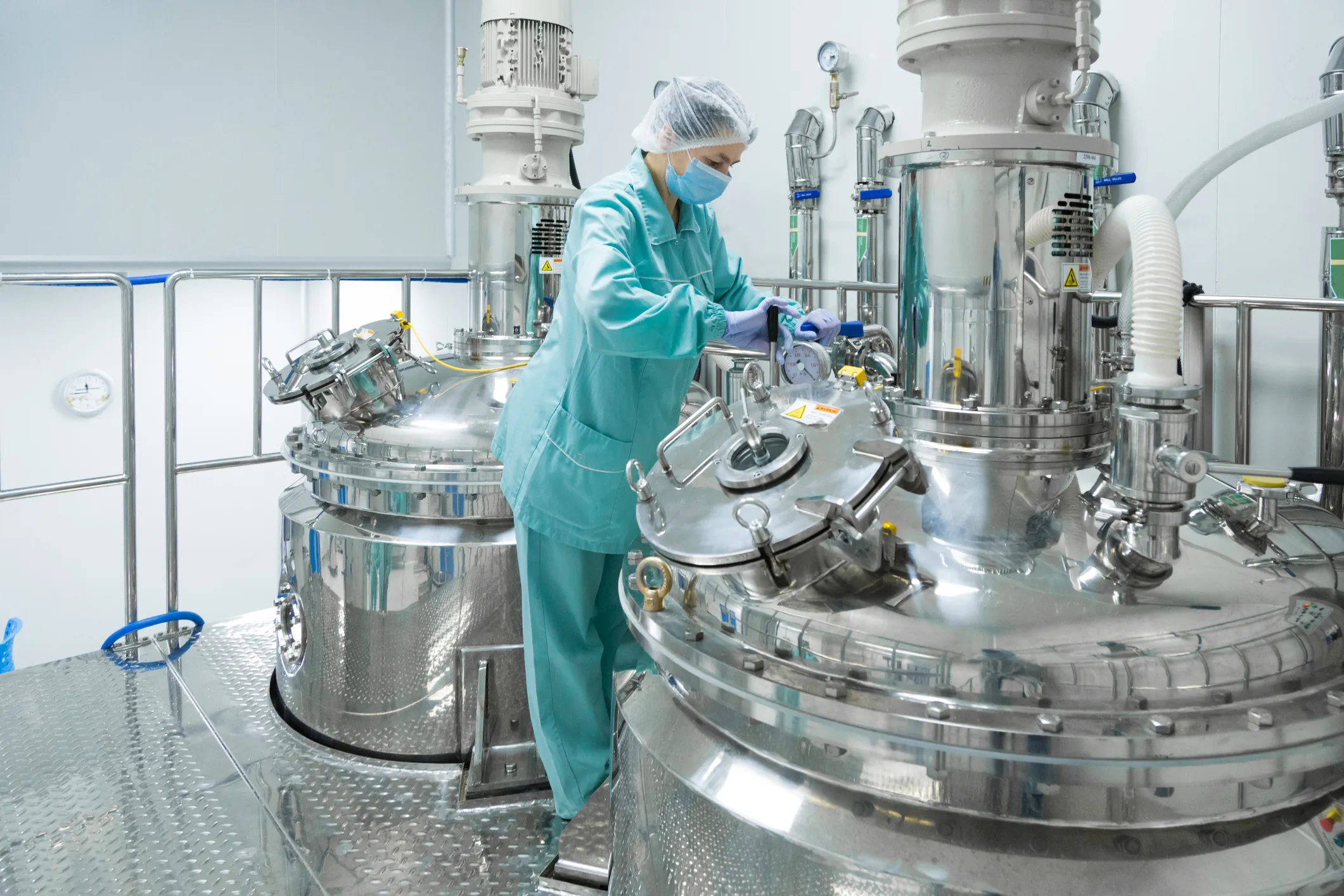 Person checking the product of a batch automation process
